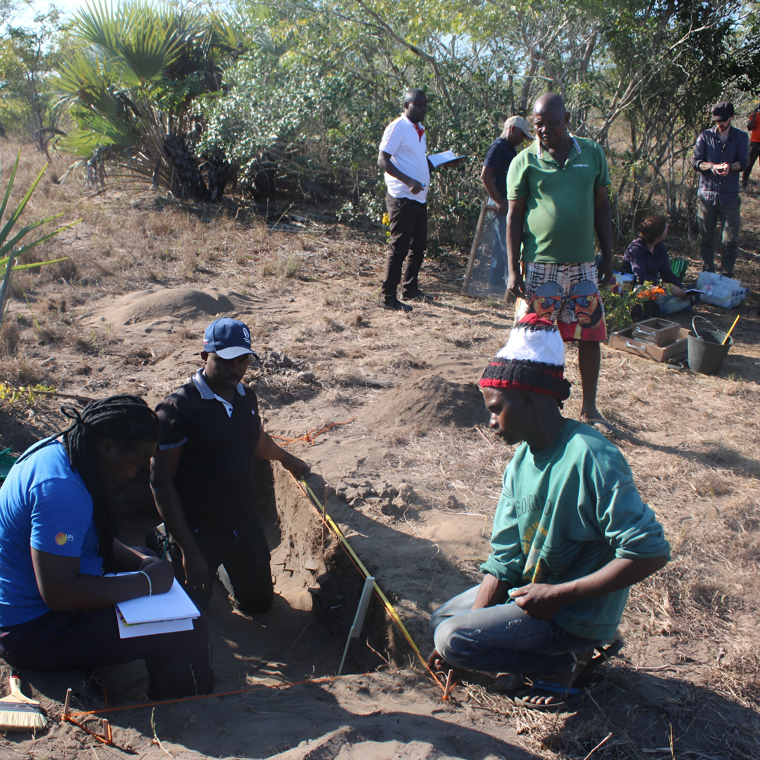 Entangled team and collaborators excavating test pits at Ngomene, August 2024.